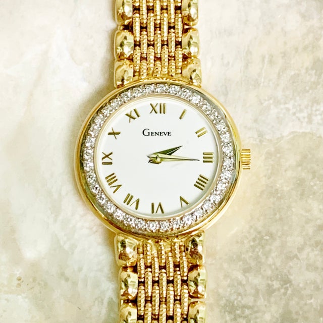 Gold watch at Masterpiece Jewelers
